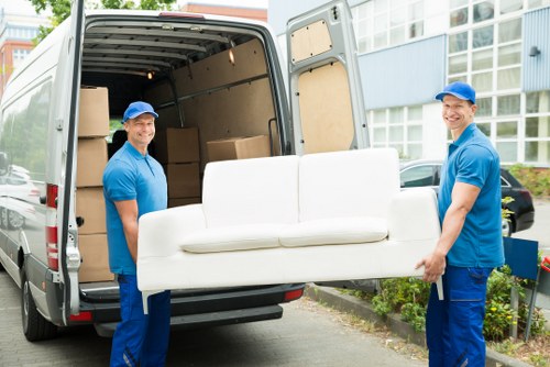 Removal team preparing a safe lifting plan before a move