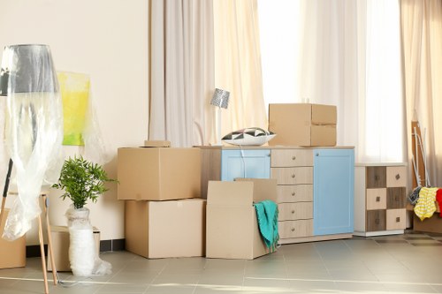 Moving boxes and furniture prepared for a Roehampton home removal