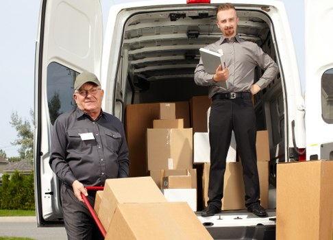 Careful moving of household items in a Roehampton street