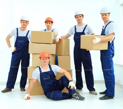 Packed boxes and dismantled furniture ready for flat removals in Roehampton