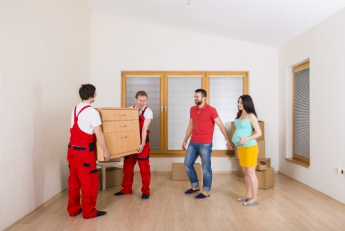 Furniture and boxes being loaded for transport in Roehampton