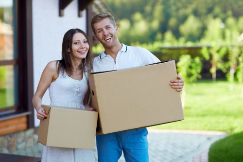 Packed household boxes and furniture ready for a Roehampton house move
