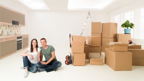 Organised unloading of student furniture and boxes at a Roehampton home