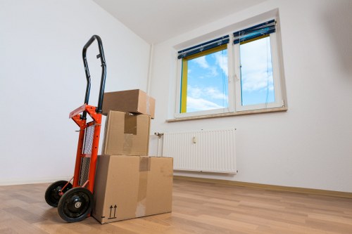 Careful loading of sofas, tables, and household furniture into a removals vehicle