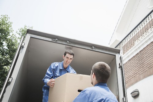 Local moving team handling packing tasks in a Roehampton property