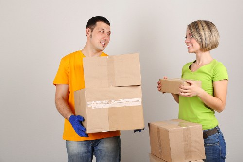 Furniture and boxes being loaded into a removal truck in Roehampton